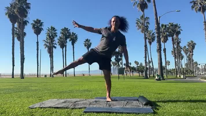 A practitioner warming up on the grass
