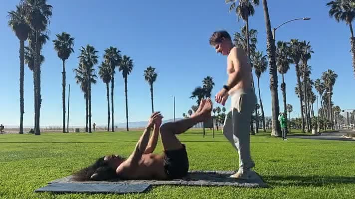 Two practitioners in an acro lift