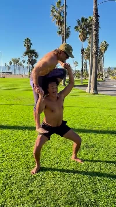 An acro balance on the mat