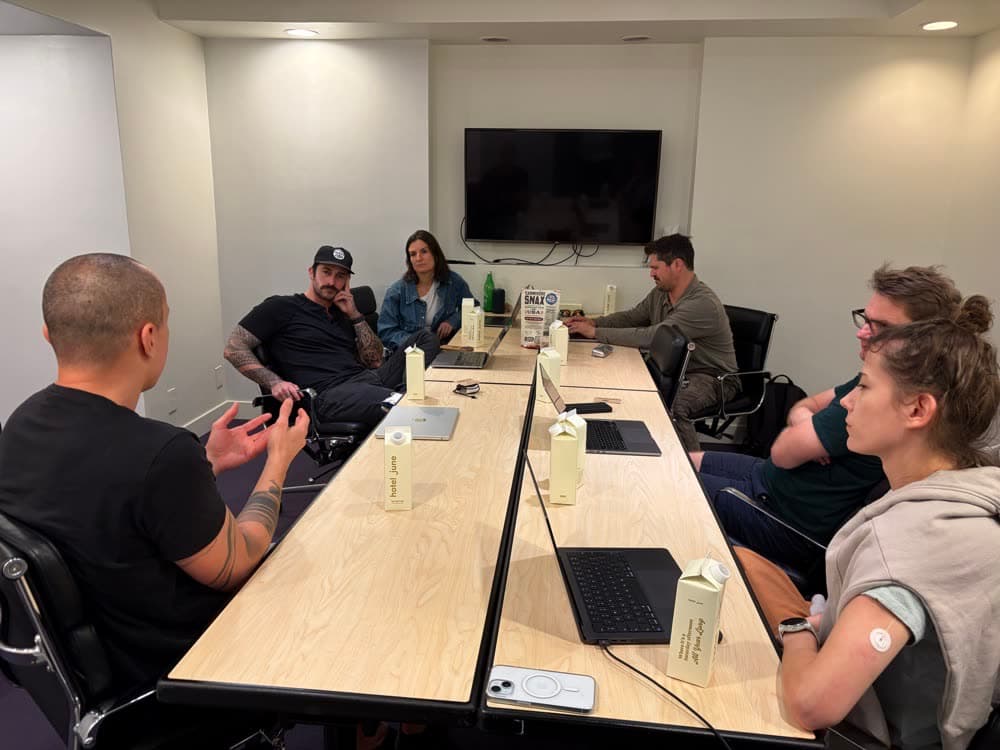 The Little Engine team talking around a conference table